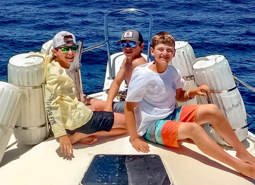 kids on the bow enjoying the Baja sun