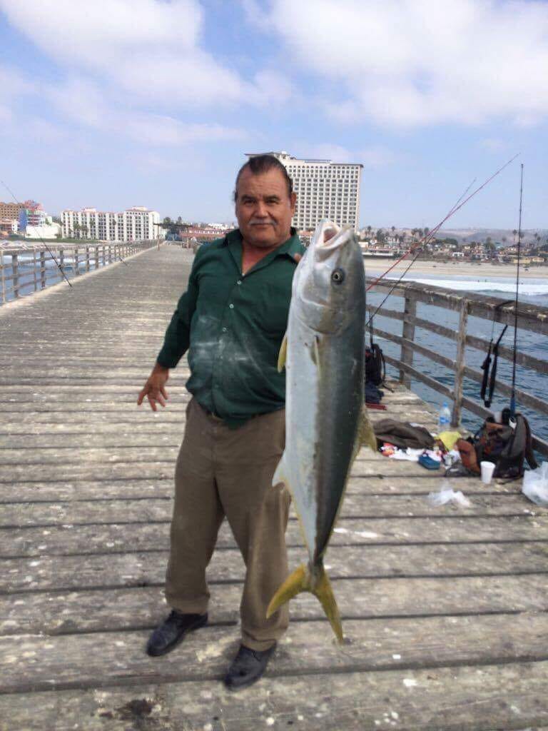Angler on Rosarita Piier with large yellowtail